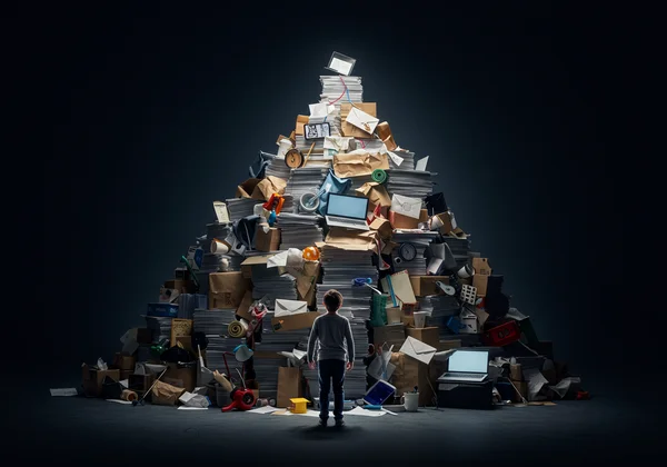 Person staring at a huge, overwhelming pile of tasks.